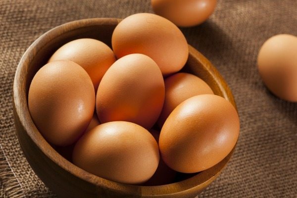 Organic Cage Free Brown Eggs on a background