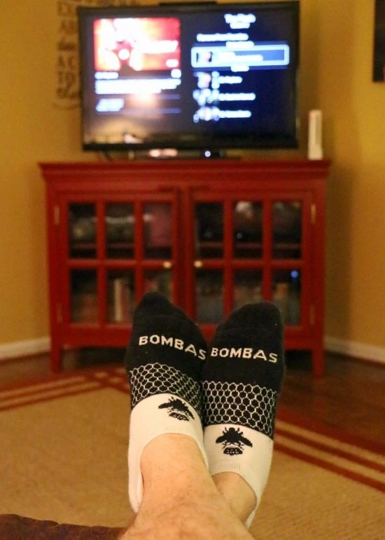 Bombas socks in front of tv