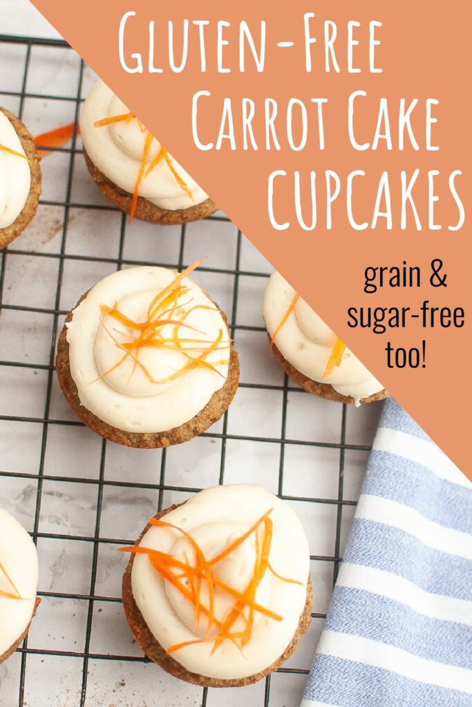 Homemade grain-free carrot cake cupcakes with frosting, garnished with carrot strips.