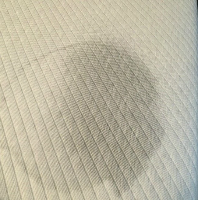 wet urine stain on mattress