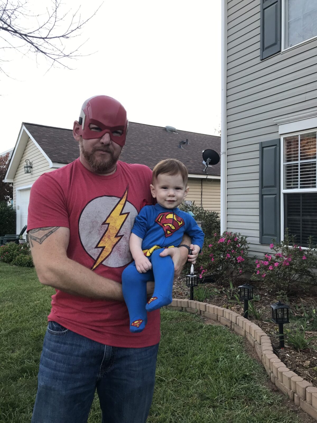 dad and son dressed as superheroes on Halloween