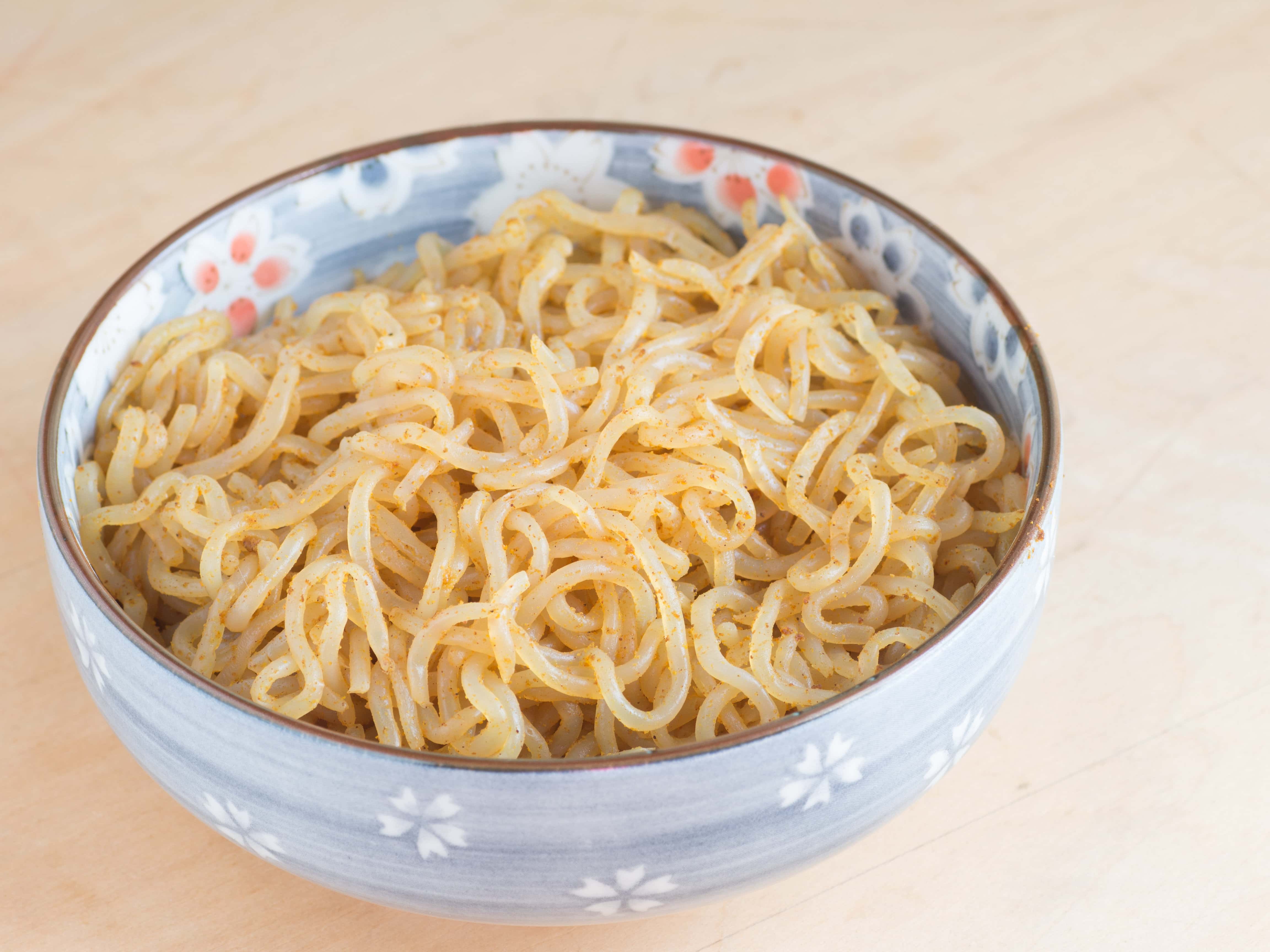 a light blue ceramic bowl of konjac noodles which are a great pasta alternative