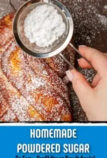 homemade powdered sugar being shaken over a loaf of sweet bread