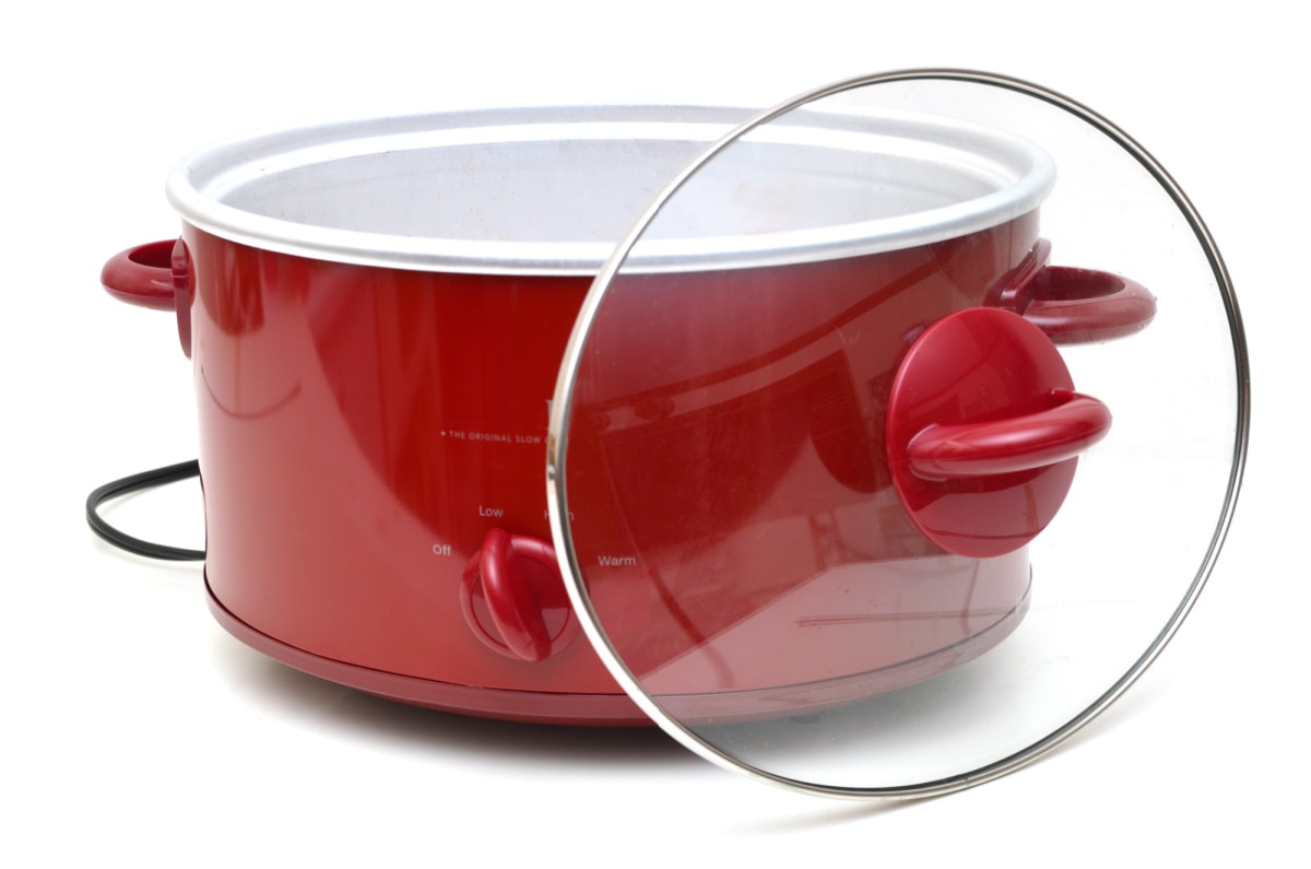 A red crock pot on a white background.