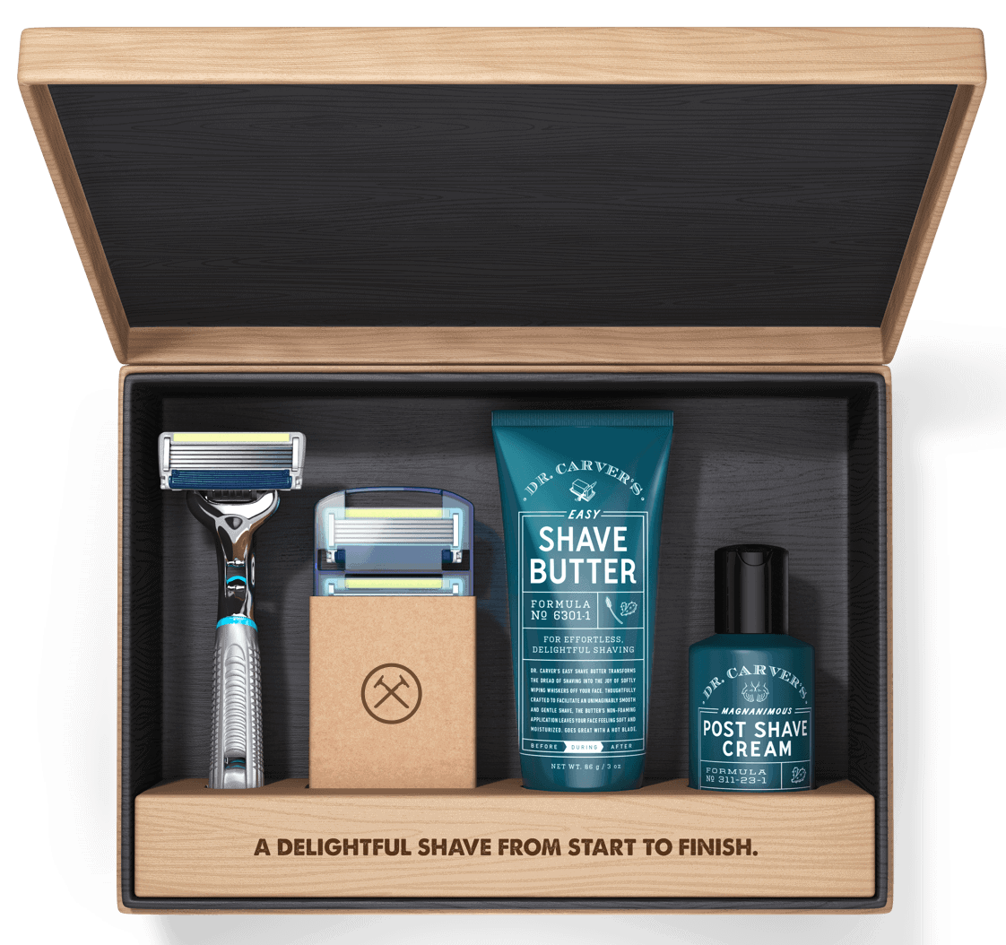 Dr. Carver's Shave Butter display in a box with two razors and post shave cream. 
