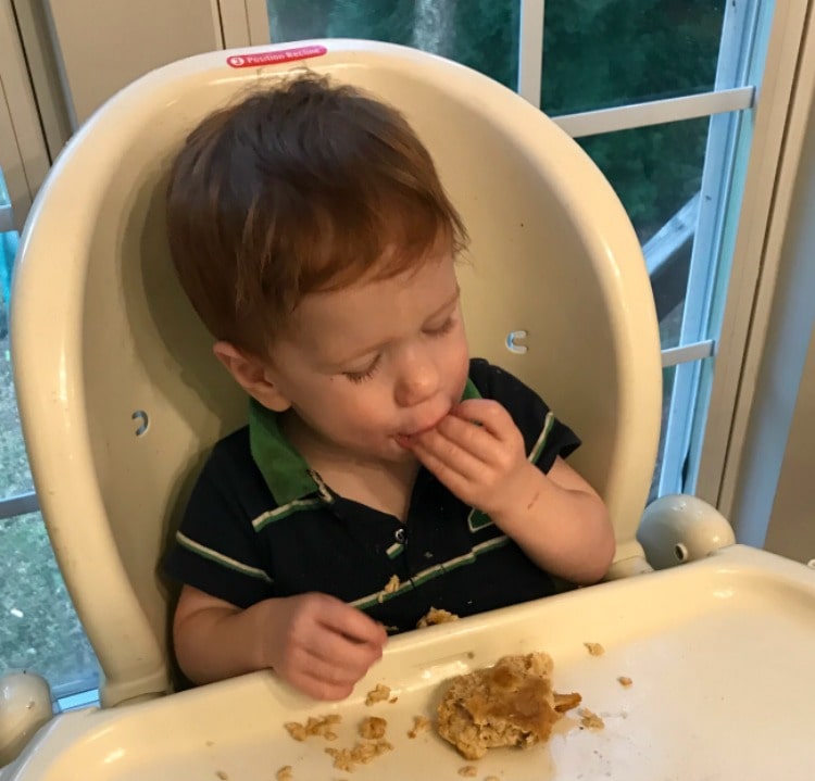 toddler eating salmon patties
