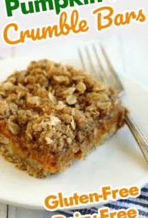 Pumpkin pie crumble bars arranged on a plate, waiting to be devoured with a fork.