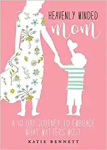 picture of the book Heavenly Minded Mom, which has a pink cover and a white figure of a mother holding a little boy's hand 
