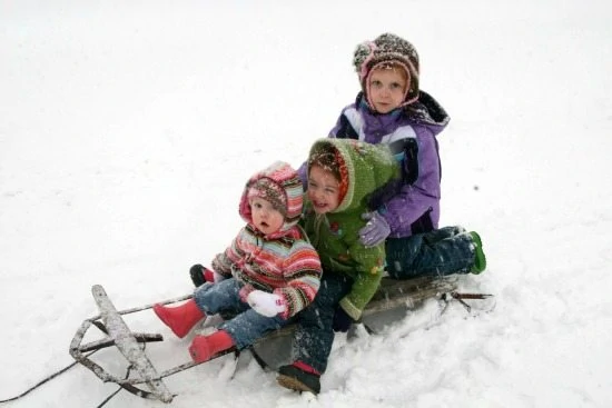 My 3 girls sledding in the snow!
