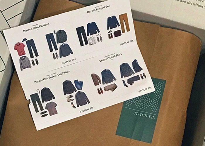 A Stitch Fix for Men box with style guide open 