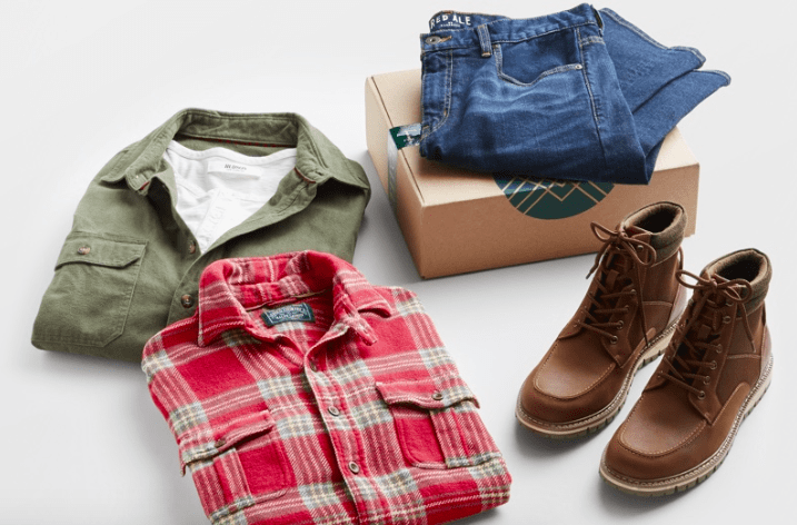 a stitch fix for men box with two men's shirts, a pair of jeans, and a pair of boots 